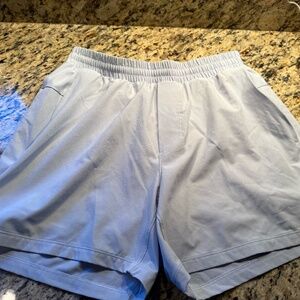 LULU LEMON MENS BABY BLUE LINED SHORTS